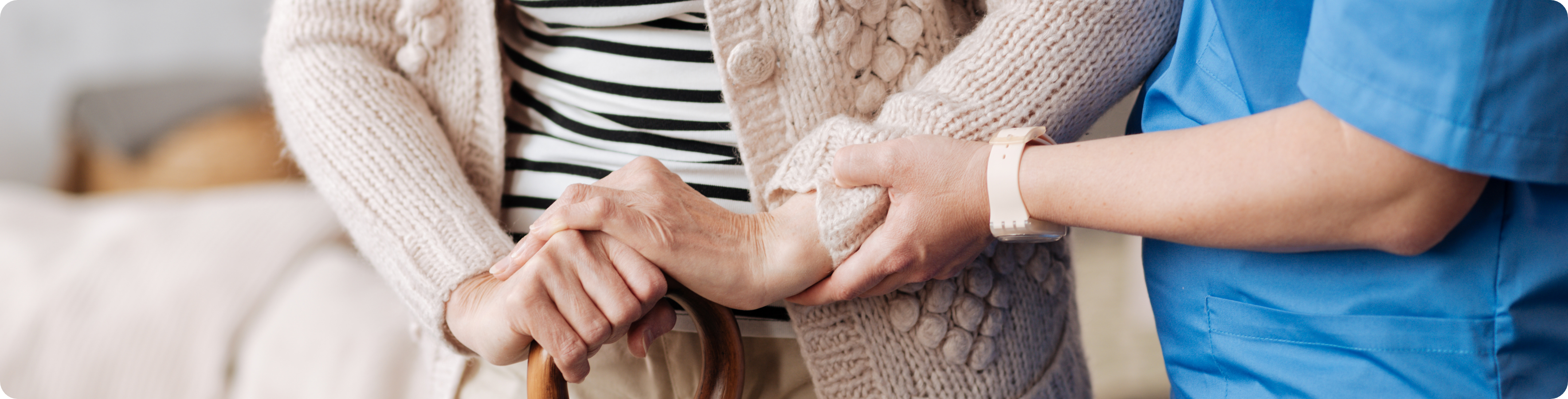 Woman holding another womans arm